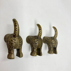 HOOK Dog Tail in Antique Brass Metal. Decorative Hardware for walls and doors